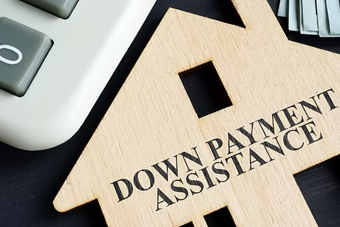 wooden home next to a calculator