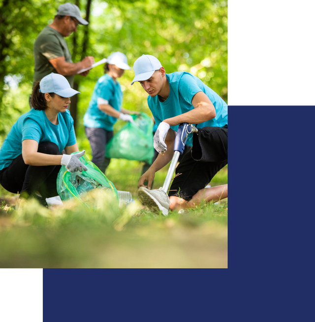 individuals cleaning up trash in the park