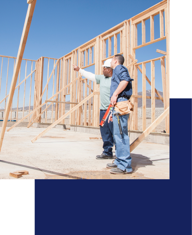 Two men building a home