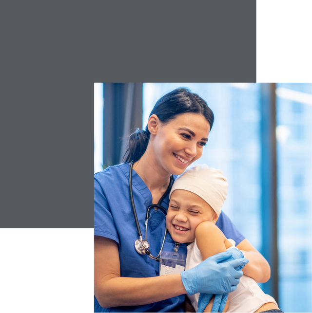 A doctor smiling while holding her patient